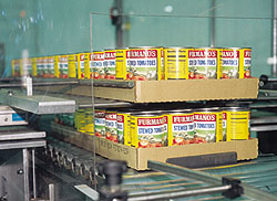 A new tray stacker is part of Furman's $3.5 million renovation made to three packaging lines. The system stacks five trays in tw