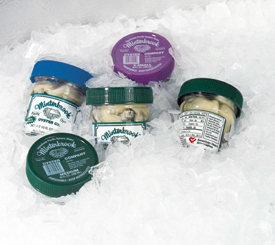 Since new labels and a large plastic cap were made part of the package, the container has much better impact on display. Inset s