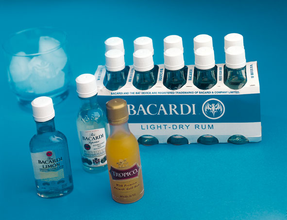 Ten 50-mL rum bottles are packed in an open-ended, neck-through paperboard carton to secure the bottles during case packing and