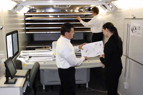 WORK IN PROGRESS. Menasha Packaging and Morton Salt representatives review a sketch for the table salt trays inside Menasha's mo