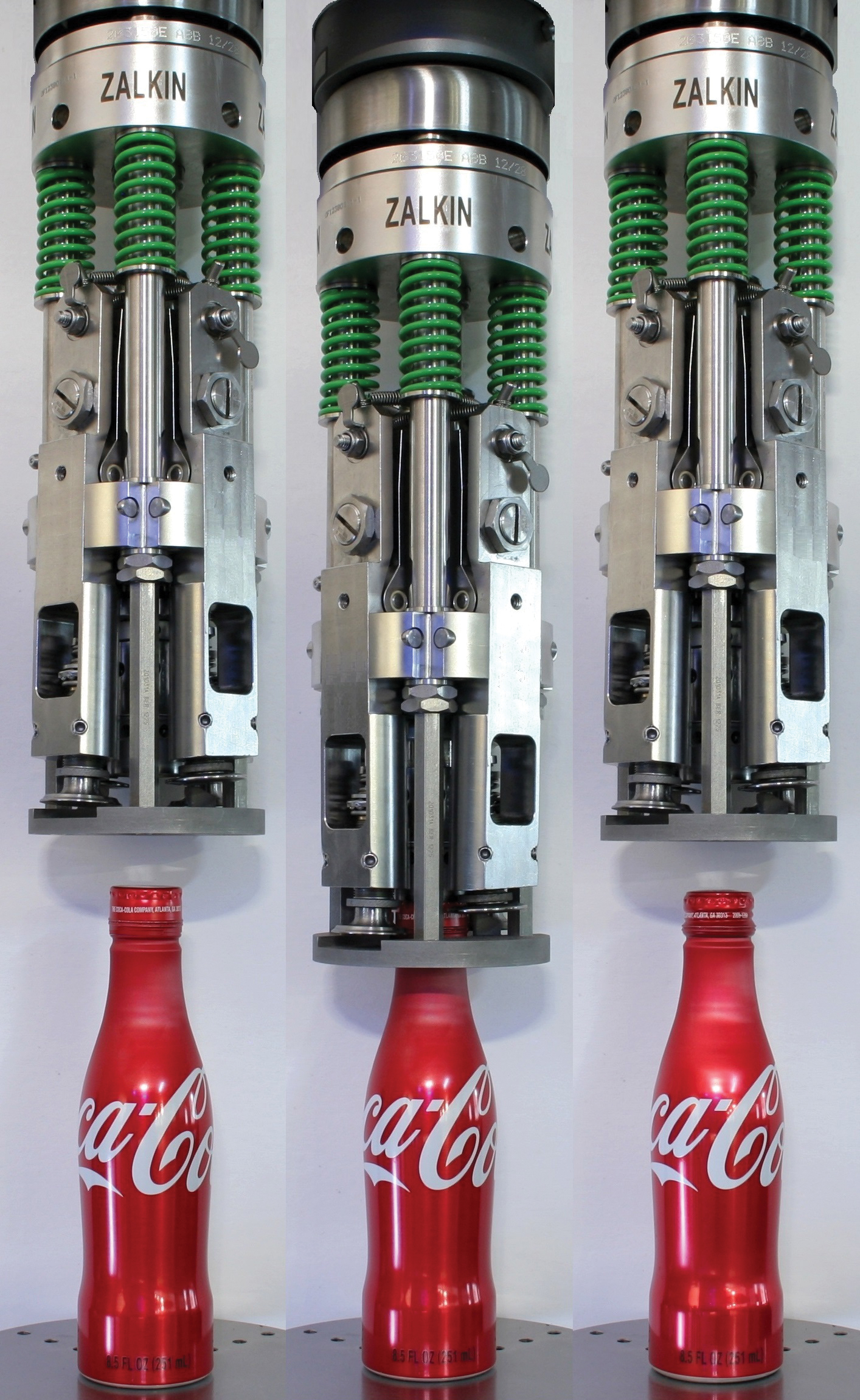 DOUBLE ACTING. Using tooling like this, the 20-head capping system now running in Truesdale, MO, pushes the aluminum capsule down onto the top of the bottle and also gently rolls on the cap, in the process forming the cap threads and tamper-evident band.