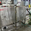 Quality assured: Bonded Pac's Tripack steam tunnel with air knife (white unit to right) from Paxton Products.