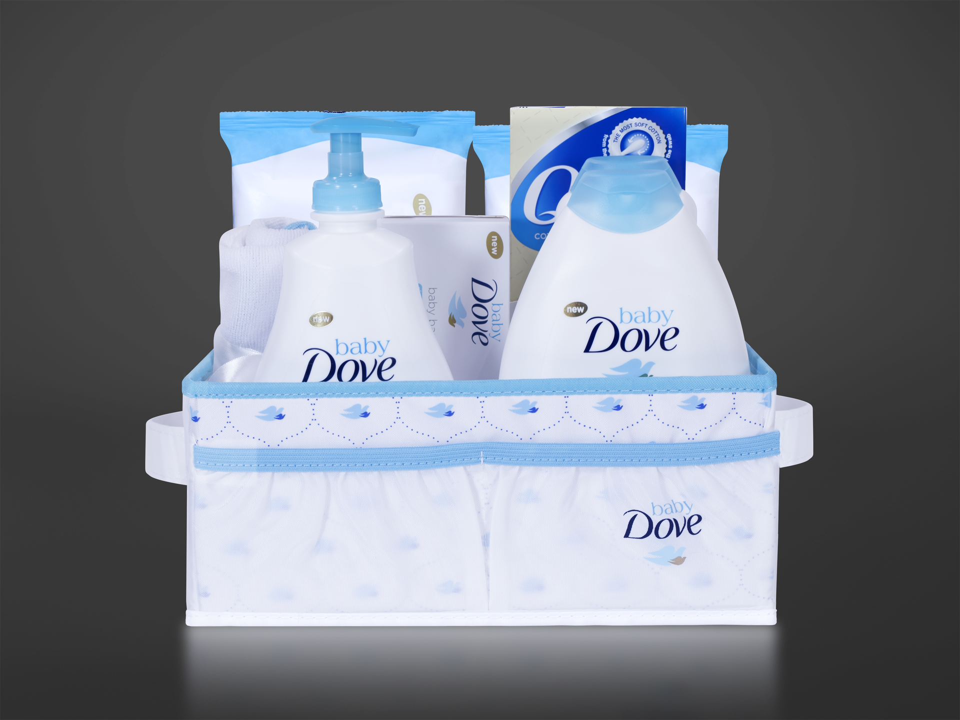 The custom-made gift basket holds a number of baby bath products as well as a winged, dove-shaped towel.