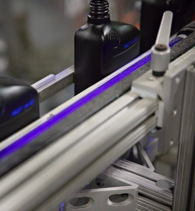 Warren runs an invisible ink that is illuminated by a UV light.