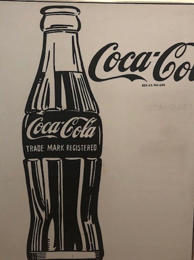 Warhol crops Coca-Cola logo in this famous print. The packaging says it all.