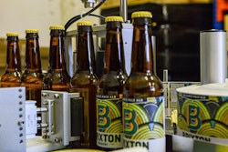 Automated filling, labeling and capping at a U.K micro brewery.