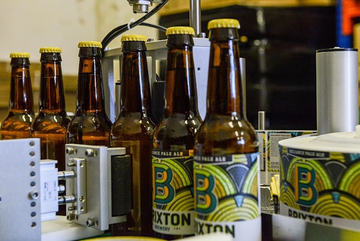 Automated filling, labeling and capping at a U.K micro brewery.