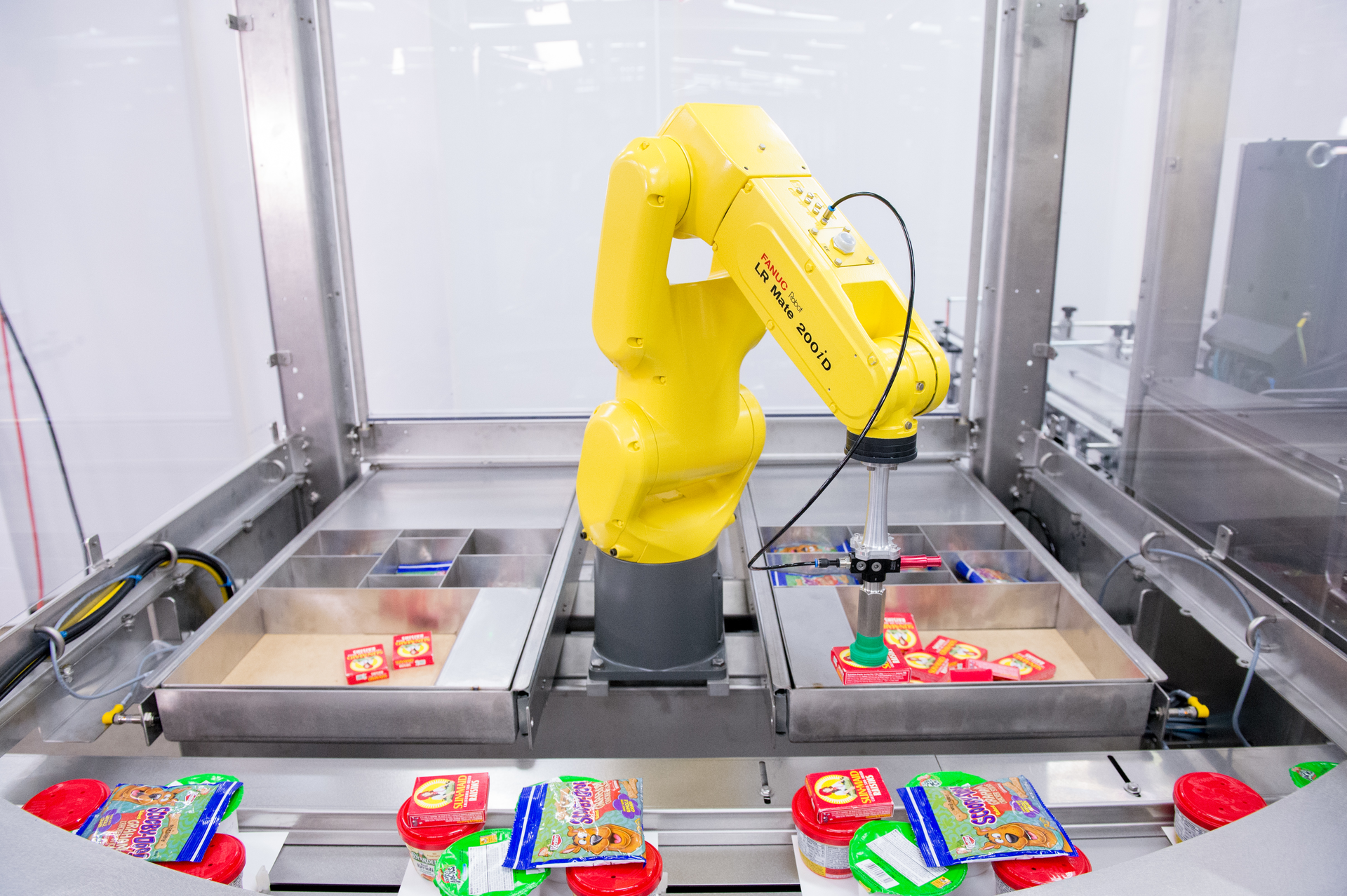 At PACK EXPO Las Vegas in fall 2019, Syntegon&rsquo;s Pack 102 horizontal flow wrapper with three Fanuc robots was demonstrated loading meal kits.