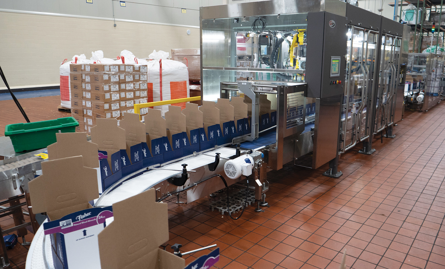 Shown here are freshly erected Cabrio Cases entering the robotic case packer.