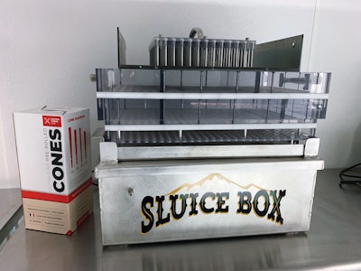 The Sluice Box filling system simultaneously fills 406 pre-roll cone wrapping papers.