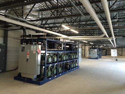 The cranberry freezing facility uses a CO2 refrigeration system that mimics supermarket refrigeration racks. It operates in subcritical mode on most cooling days and in supercritical mode only when necessary.