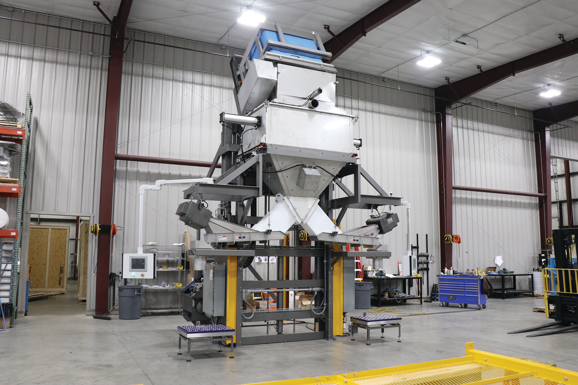 Pellets of ice move down the central &ldquo;pant leg&rdquo; and arrive on left and right electromagnetic vibratory feeders for discharge into insulated containers.