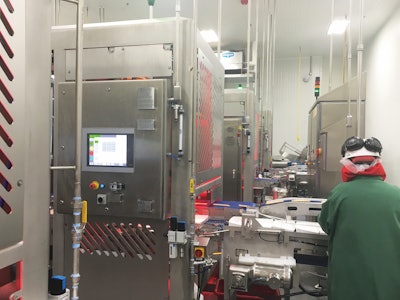 Fresh tacos on four lines enter the robotic packaging system at CTI Foods.