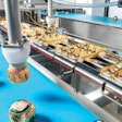 Products feed into the Schubert system via lateral belts.