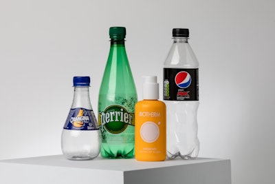 Consortium partners Suntory, Néstle Waters, L’Oréal, and PepsiCo each made a bottle from Carbios material for their (l. to r.) Orangina, Perrier, Biotherm, and Pepsi Max brands, respectively.