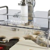 The tare gross weighing system accounts for variable-weight glass jars by weighing the empty jar, filling the jar with cannabis flower, weighing the filled jar, and finally validating the contents’ weight by comparing the feeding scale weight with the post-fill scale weight.