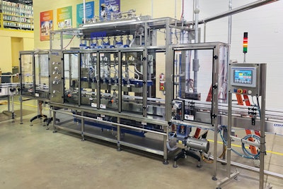 The walking-beam format of the filler means it operates on a continuous-motion basis.