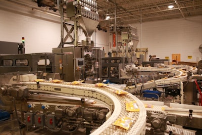 The Triangle inline combination weighers weigh the twist Caramel Creams and then they are bagged. Filled bags are moved via conveyors to Fallas Automation case packers.