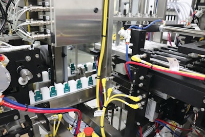 Formed packs moving into the side seal station.