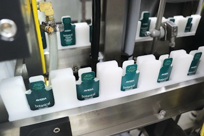 Formed packs moving into the side seal station.