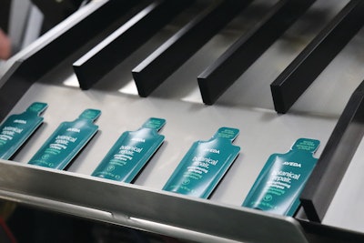 Completed primary packaging packets, ejected through shoots and ready for secondary packaging that varies by application.