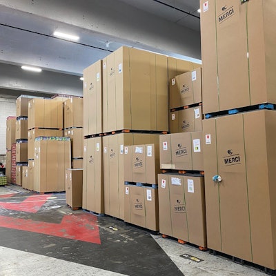 Eschewing plastic film as a means of securing pallet loads of printed cans, Hart uses double-wall corrugated and strapping instead.