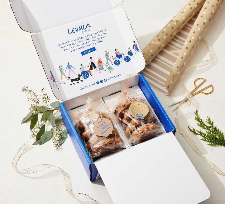 An eight-count box of cookies uses two universal inserts to protect the cookies during transit.