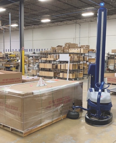 The portable, semi-automatic stretch wrapper moves around the load to apply the stretch-wrap film.