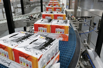 Cartons of Surf, the newest MAB product that combines various flavors of White Claw, roll off the packaging line.