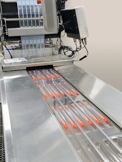 Deer and cattle darts are placed in two-cavity thermoformed trays, three trays across, prior to lidding on the Harpak-Ulma equipment.