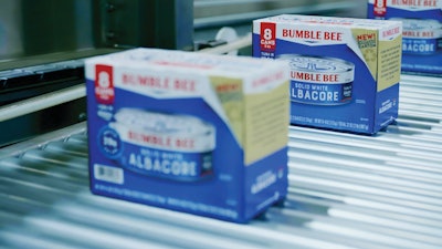 Cartoned product is oriented and laned after outfeed from the cartoner.