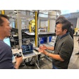 Zenni Director of Distribution and Facilities Simon Goh (right), talks about the deployment now underway with OSARO’s Bryan Yong, a Senior Solutions Engineer at the AI robotics company's San Francisco Robot Lab.