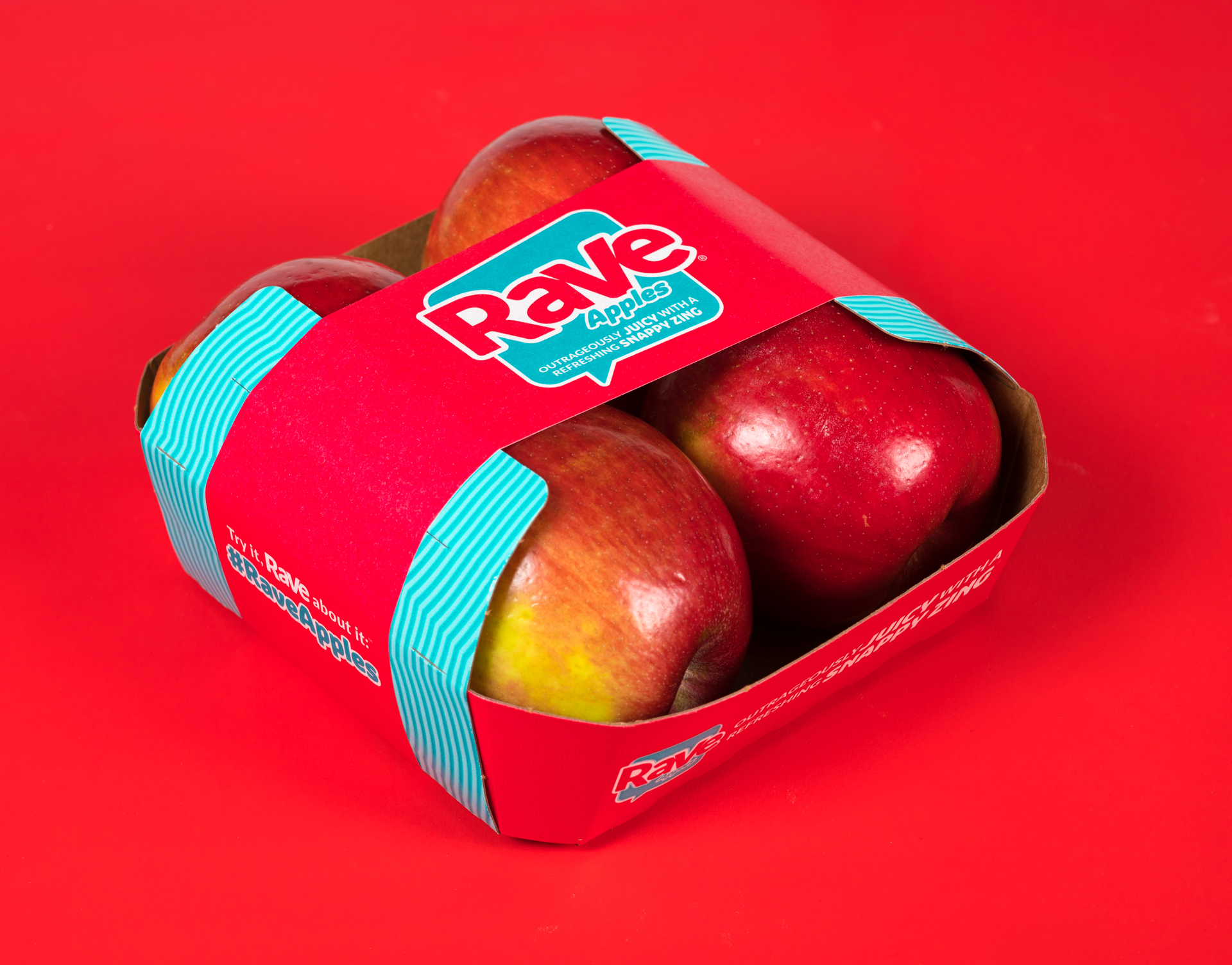 The EZ Band comprises a paperboard tray that holds four apples coupled with a paper band that encircles the tray top to bottom.