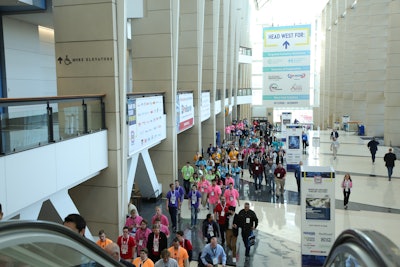 Amazing Packaging Race participants head toward the show floor.