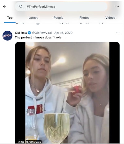 An example of #ThePerfectMimosa influencer trend, as it appeared on Twitter. In this case a household baster is being used to add a single drop of OJ to a full glass of Champagne.