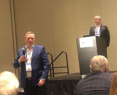 Schneider Electric's Gregory Tink, Director, Industrial Digital Transformation, and Thomas Eck, U.S.Media Relations Manager, answer questions during a press conference at the ARC Industry Forum in Orlando.