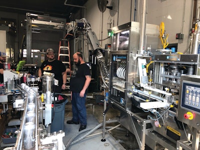 The Pneumatic Scale Angelus CB50C counter-pressure filler and seamer combo (right) runs quickly and accurately with low D.O. pickup.