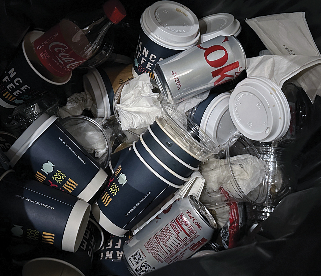 A real image of a trash bin at a sustainable packaging conference.