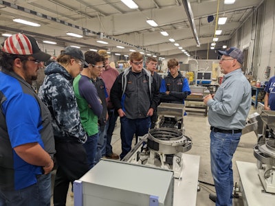 Chris Schombert, executive VP of Hoosier Feeder Company, speaking to New Castle Career Center students.