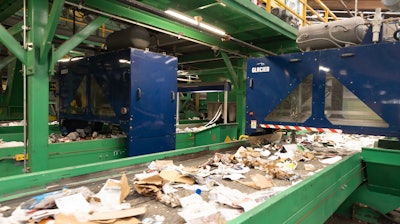 A stream of recycled waste, mostly packaging, enters Glacier's AI-supported robotic sortation equipment.