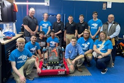 The L.C. Bird RoboHawks gather around their robot with Dana Greenly (top right), Katy Clarke (bottom right), and members of BPA.