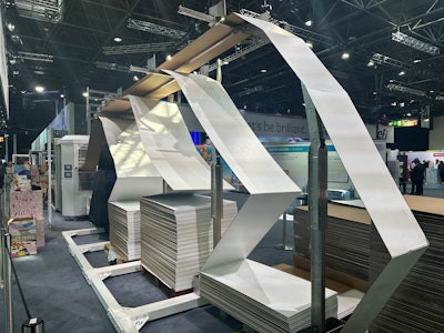 Four lanes of paper-coated fanfold or Z-fold material being fed into the system.