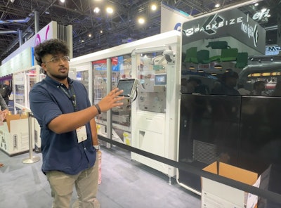 Kiran Shibu, R&D quality engineer at Packsize, demonstrates the X5 Nozomi at drupa.