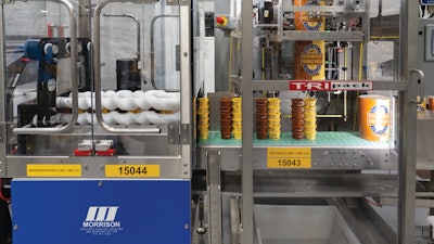 The final set of Morrison timing screws is a stacked screw system that guides stacks of cups forward with just the right spacing so that the Tripack shrink sleever can drop sleeves over paired stacks.