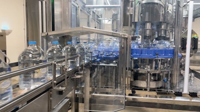 Bottles are filled on an eight-head monoblock filler from Fogg Filler, with capping (center right) immediately following.