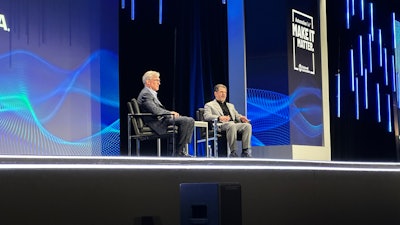 Rev Lebaredian (right), VP of omniverse and simulation tech at Nvidia, joined Rockwell CEO Blake Moret on stage to address AI in industrial automation.