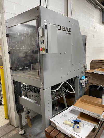 Tray erection on Switchback equipment in the warehouse.