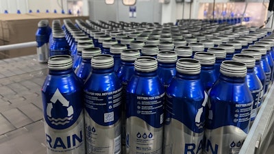 Depalletized bottles are single-filed and lowerated before air rinsing and filling.