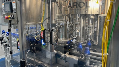 Bottles receive an inert gas headspace flush before caps are gently torqued into place.