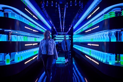 In Room 4, an endless conveyor belt of plastic waste moves through the space, symbolizing society’s heavy reliance on mass-produced plastic materials for convenience. Image courtesy of SC Johnson